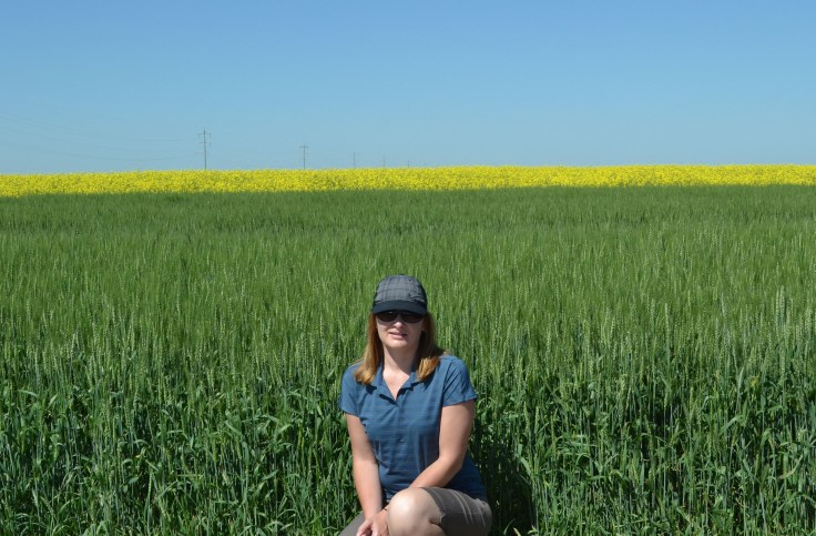 Posing in front of green wheat, yellow canola and a blue sky. 