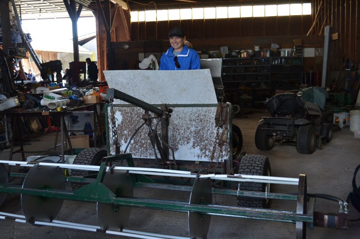 Testing my skills on one of the machines that harvests the cranberries. 