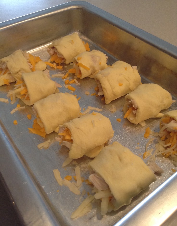 Line up the rolls in a pan. 