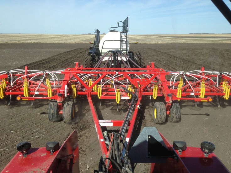 In the driver's seat. A view from the tractor cab. 