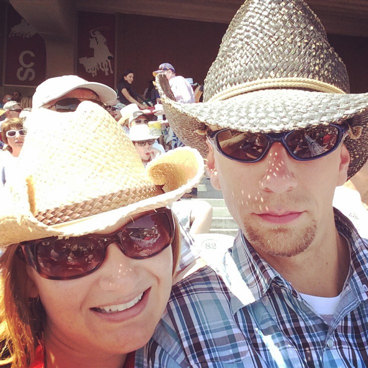 Taking in the rodeo on a hot afternoon.